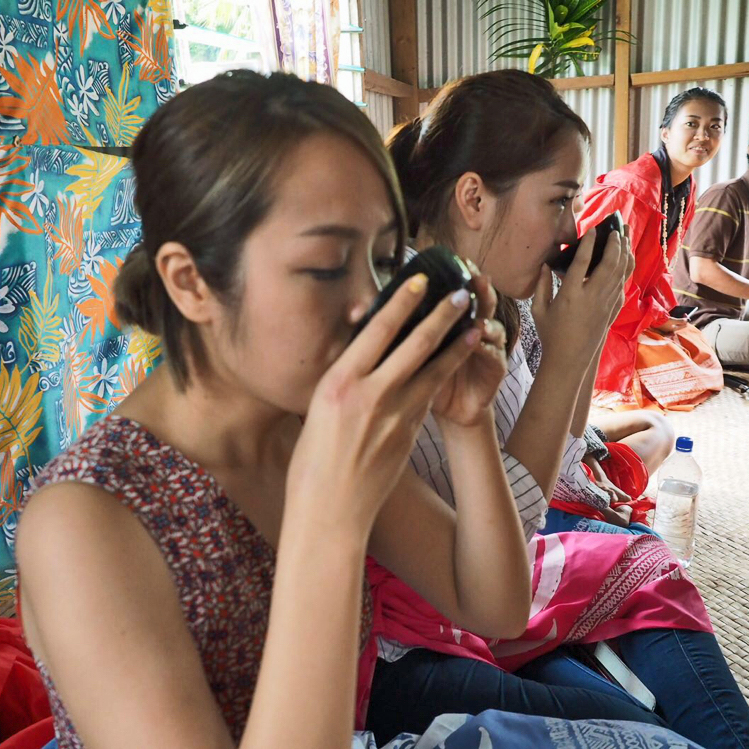 Visitor Drinking Kava in a Village 