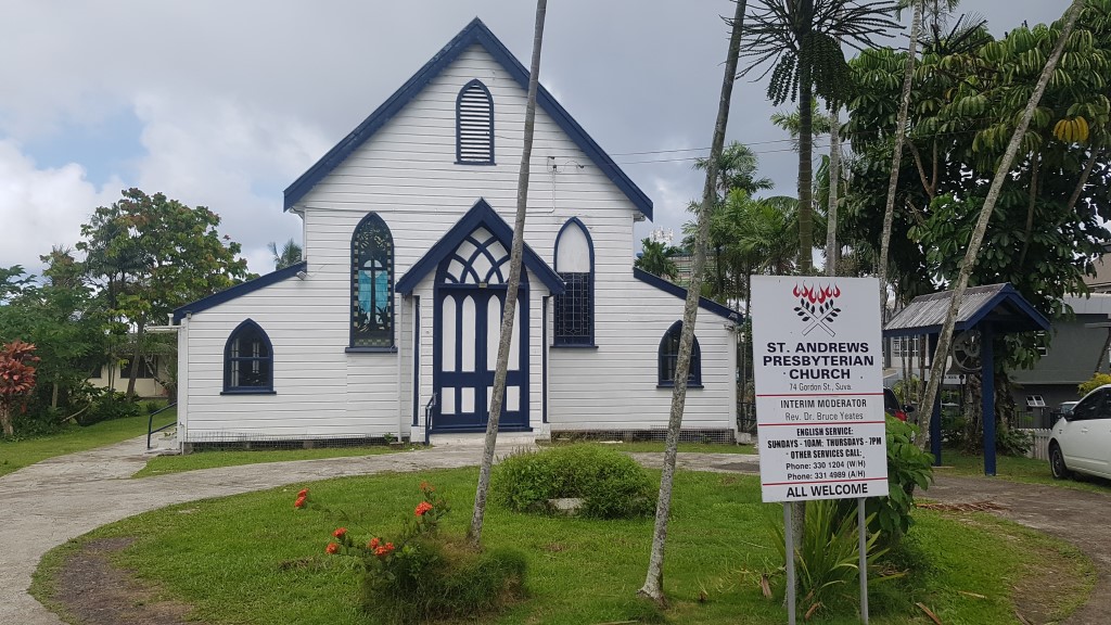 The St. Andrews Presbyterian Church is a folk Gothic Revival building with a front-facing gable form and two bays on either side.